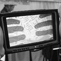 SEE-THROUGH SCREEN: Computer scientist Patrick Baudisch demonstrates LucidTouch, a touch screen for mobile devices, on display at TechFest 2008, Microsoft's annual innovation event, in Redmond, Wash. This emerging technology allows people to touch devices from the back, creating the illusion of the device itself being semitransparent.